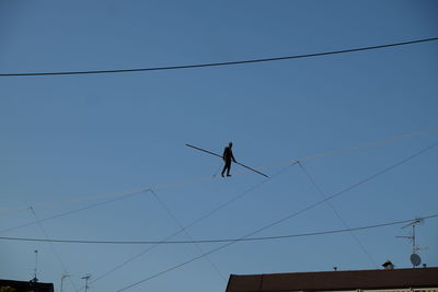 Low angle view of cables against clear sky