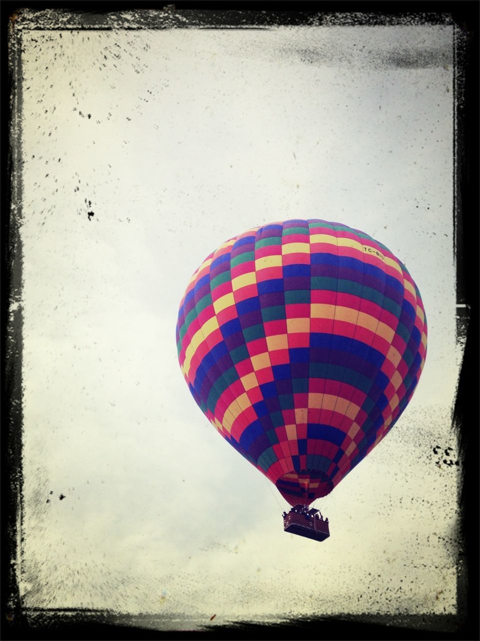 multi colored, auto post production filter, red, transfer print, transportation, flying, mid-air, low angle view, umbrella, outdoors, hanging, day, sport, hot air balloon, no people, parachute, pattern, protection, extreme sports, adventure