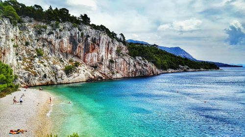 Scenic view of sea against cloudy sky