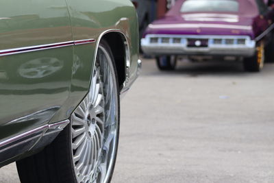 Close-up of vintage car on street