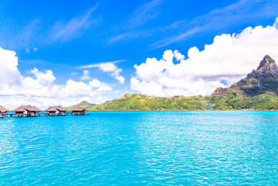 Scenic view of sea against blue sky