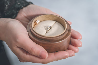 Cropped hand of person holding ring