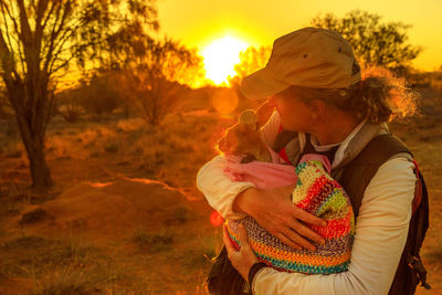 Close-up of woman holding kangaroo