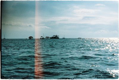 Scenic view of calm sea against blue sky