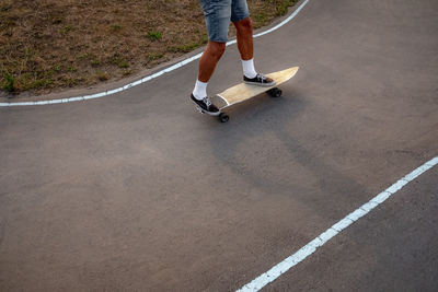 Low section of man skateboarding on skateboard