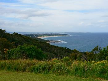 Scenic view of sea against cloudy sky