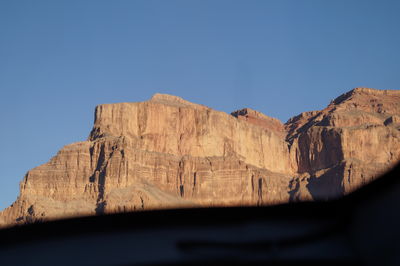 Low angle view of mountain against clear sky