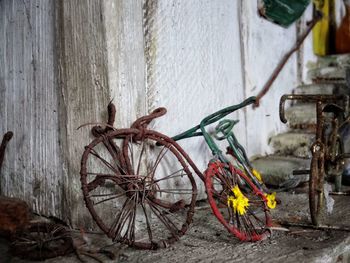 Close-up of bicycle against wall