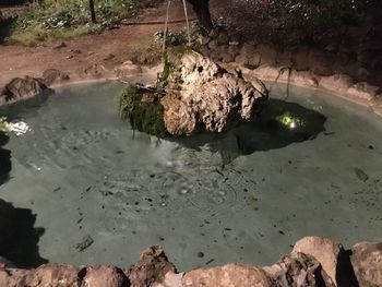 High angle view of rock formations in water