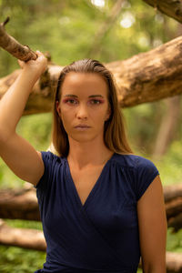 Portrait of young woman standing outdoors