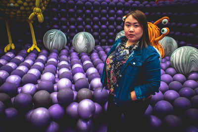 Portrait of woman with colorful balloons