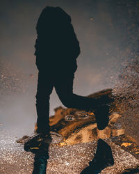 Shadow of man walking on street