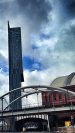 Low angle view of building against cloudy sky