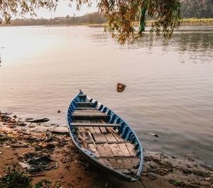 Boat moored on lake