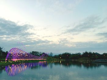 Scenic view of lake against sky at dusk