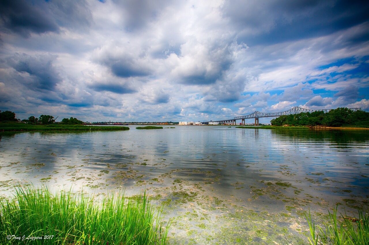 cloud - sky, water, sky, nature, scenics, beauty in nature, tranquil scene, outdoors, tranquility, no people, day, lake, travel destinations, architecture, tree, grass