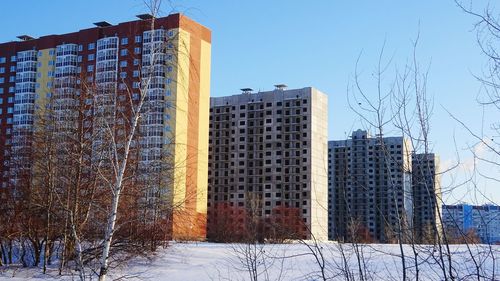 Buildings in city against sky