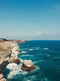 Scenic view of sea against blue sky