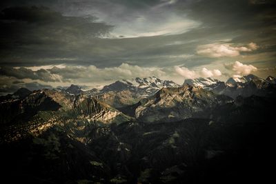 Aerial view of landscape against cloudy sky