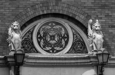 Low angle view of statue against building