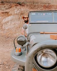 Portrait of man sitting in car