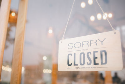 Close-up of text on glass at store