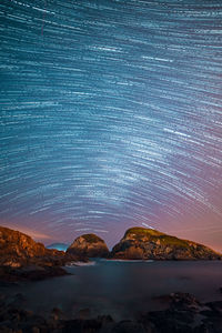 Scenic view of sea against sky at night