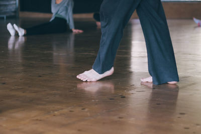 Low section of ballet dancer practicing in studio