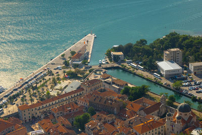 High angle view of buildings by sea