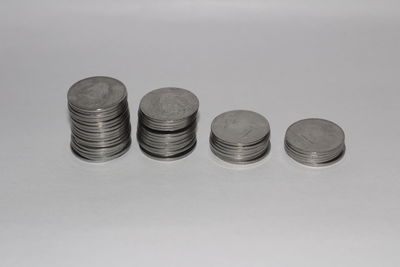 Close-up of coins against white background
