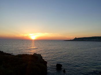 Scenic view of sunset over sea