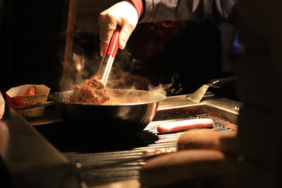 Midsection of person preparing food