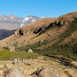 Scenic view of rocky mountains against clear blue sky