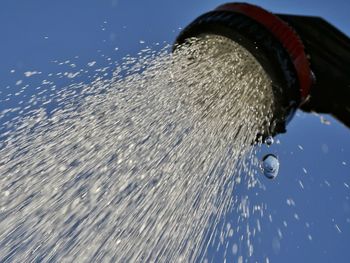 Low angle view of water splashing from shower