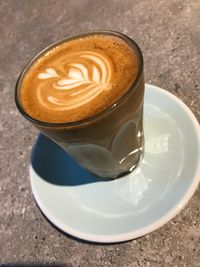 High angle view of cappuccino on table