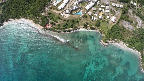 Aerial view of city by sea