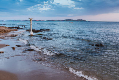 Scenic view of sea against cloudy sky