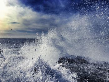 Scenic view of sea against cloudy sky