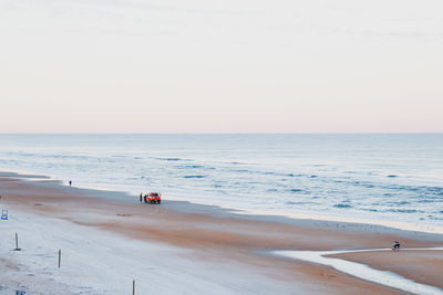 Scenic view of beach against clear sky