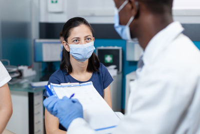 Doctor examining patient at hospital