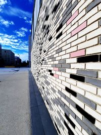 Street by building against sky