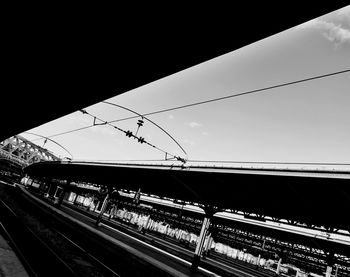 Low angle view of railroad tracks against sky