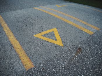 High angle view of arrow sign on road