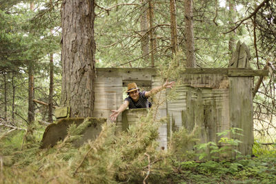 Woman in the forest hut, tree house