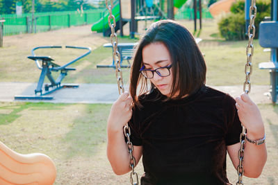 Woman on swing at playground