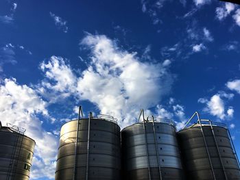 Low angle view of factory against sky