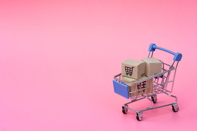 Close-up of toys against pink background