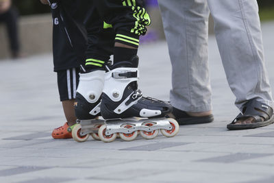 Low section of people standing on street