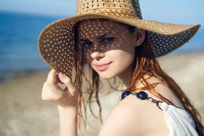 Young woman wearing hat