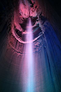 Low angle view of illuminated tunnel